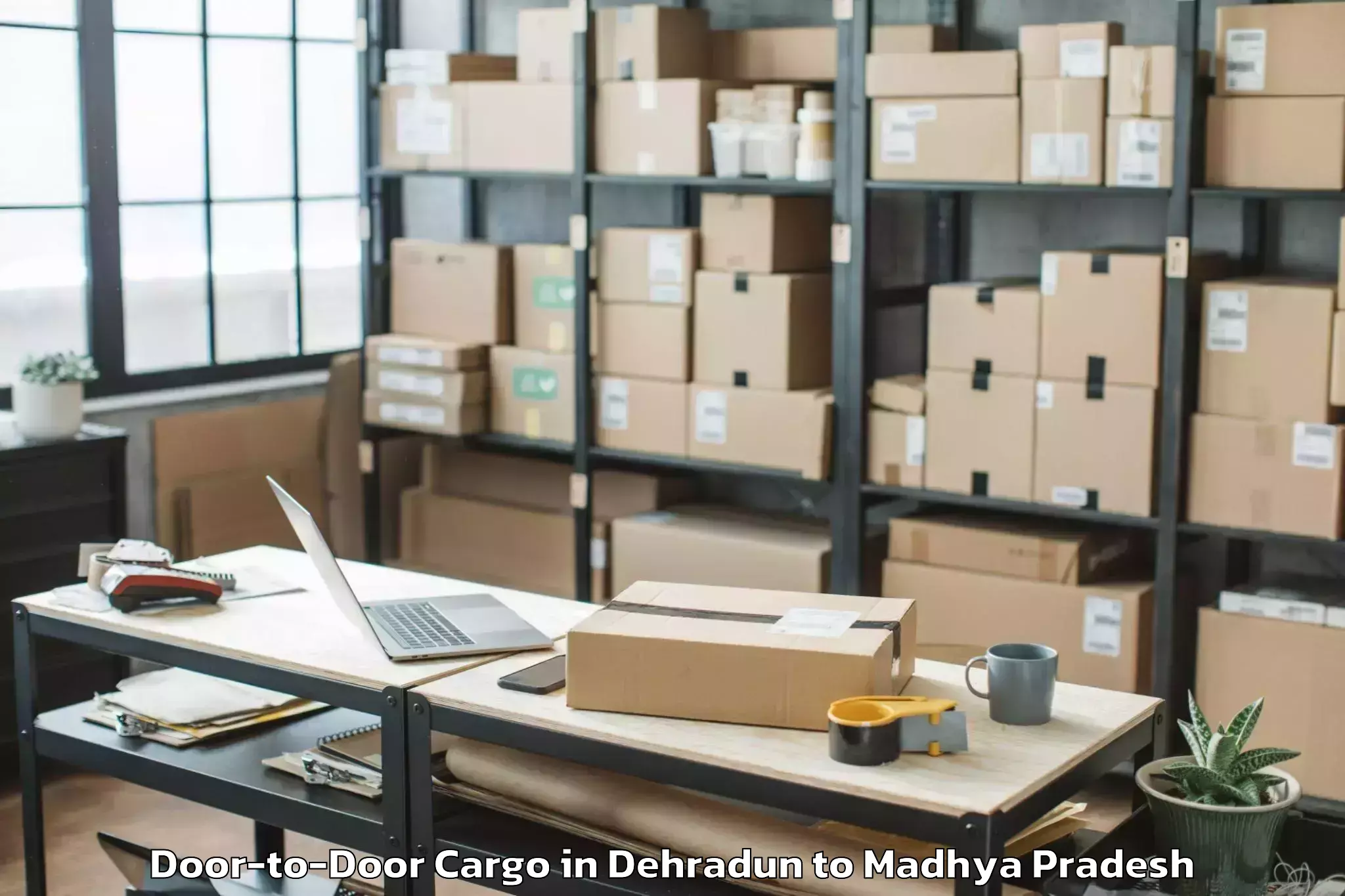 Affordable Dehradun to Maharajpur Door To Door Cargo